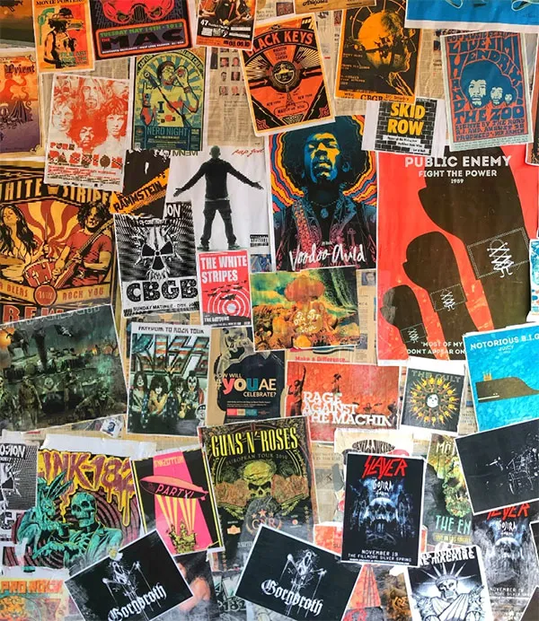 A collage of various colorful music posters covering a wall, featuring bands and artists from different genres.